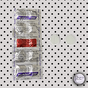 6_20240610_230034_0005 a close-up of a packet of pills